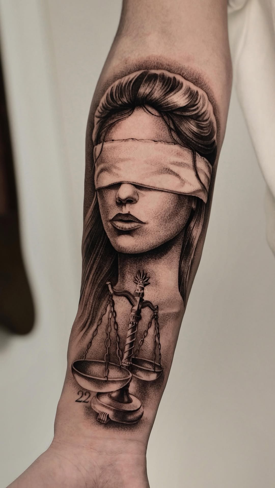 Hyper-detailed grayscale Lady Justice with blindfold and scales.