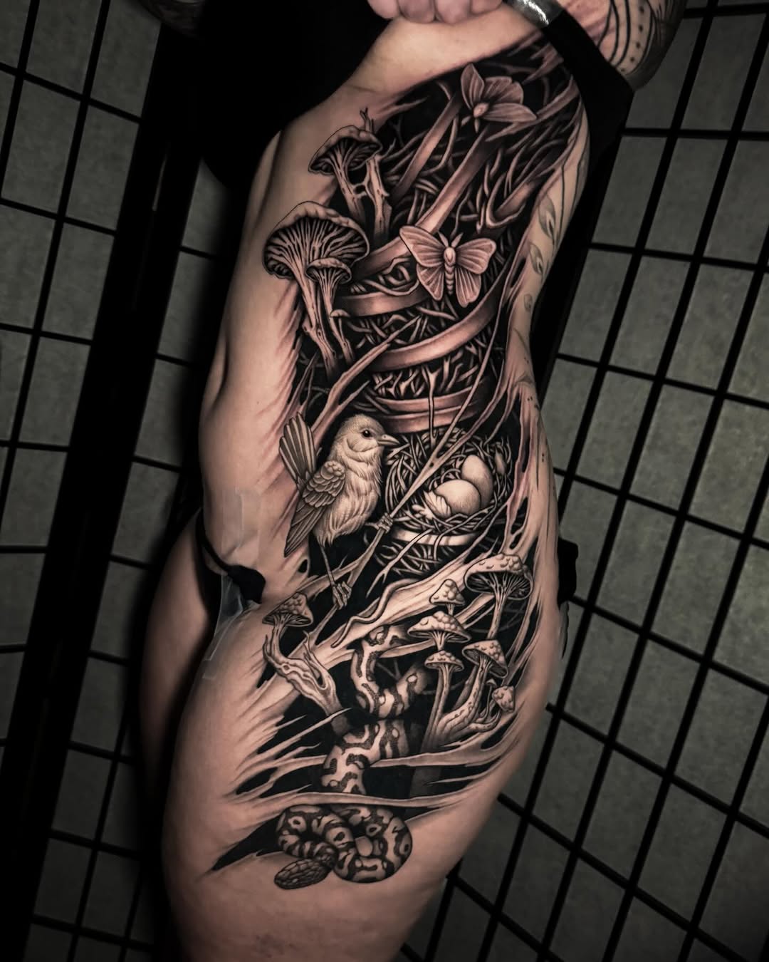 Intricate grayscale woodland scene with mushrooms and bird.