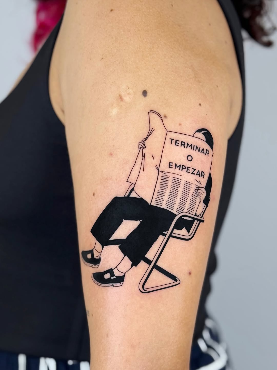 Minimalist bold-line figure reading a newspaper on chair