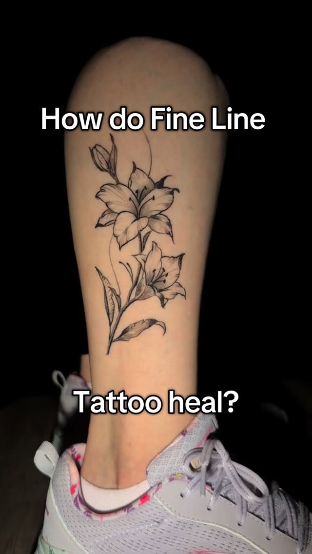 Delicate fine-line floral on forearm, crisp black ink.