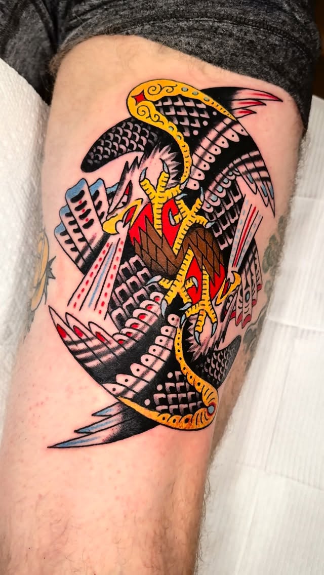 Bold neo-traditional eagle clash with intertwined wings, vibrant colors