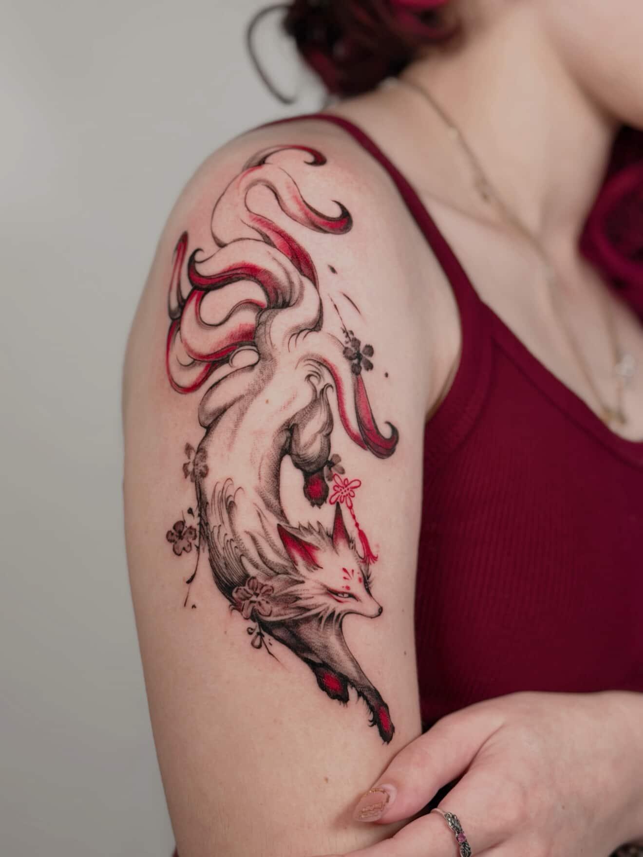 Stylized fox with flowing red-black linework and blossoms.