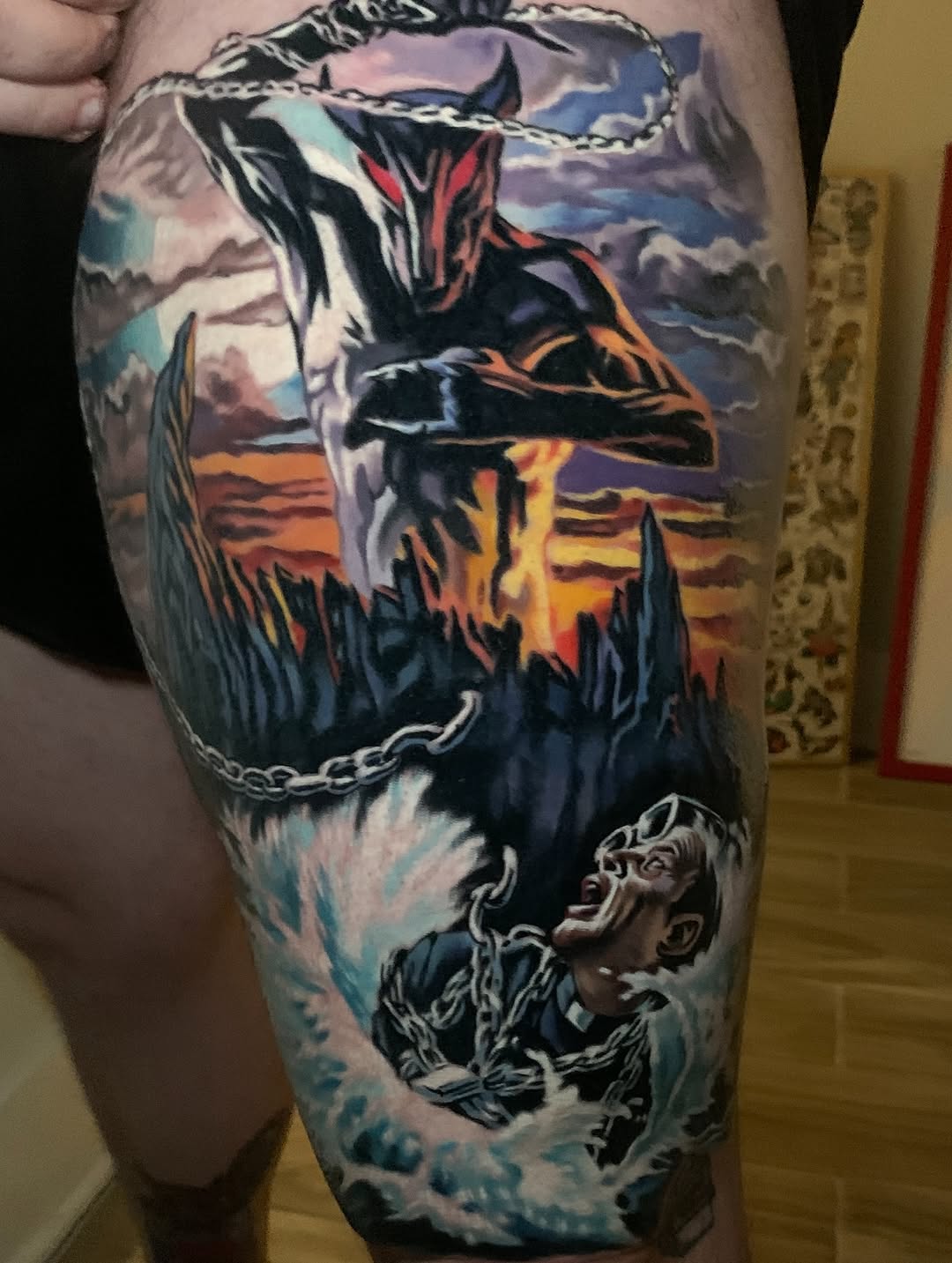 Dynamic neo-traditional demon figure chained above a fiery sunset