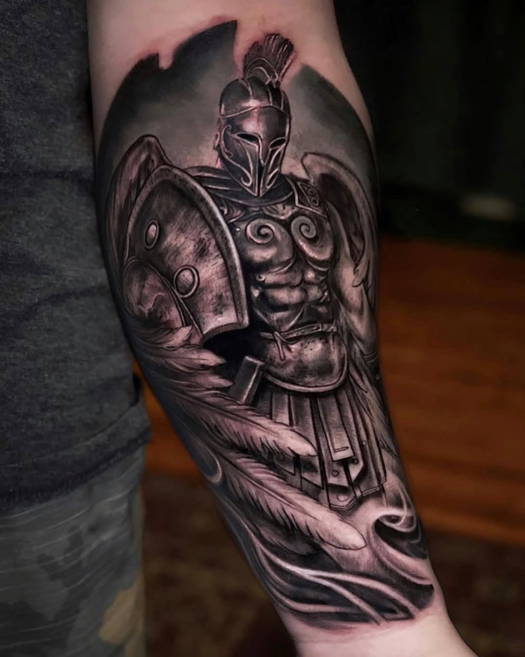 Monochrome Spartan warrior helmet with shield, dramatic shading