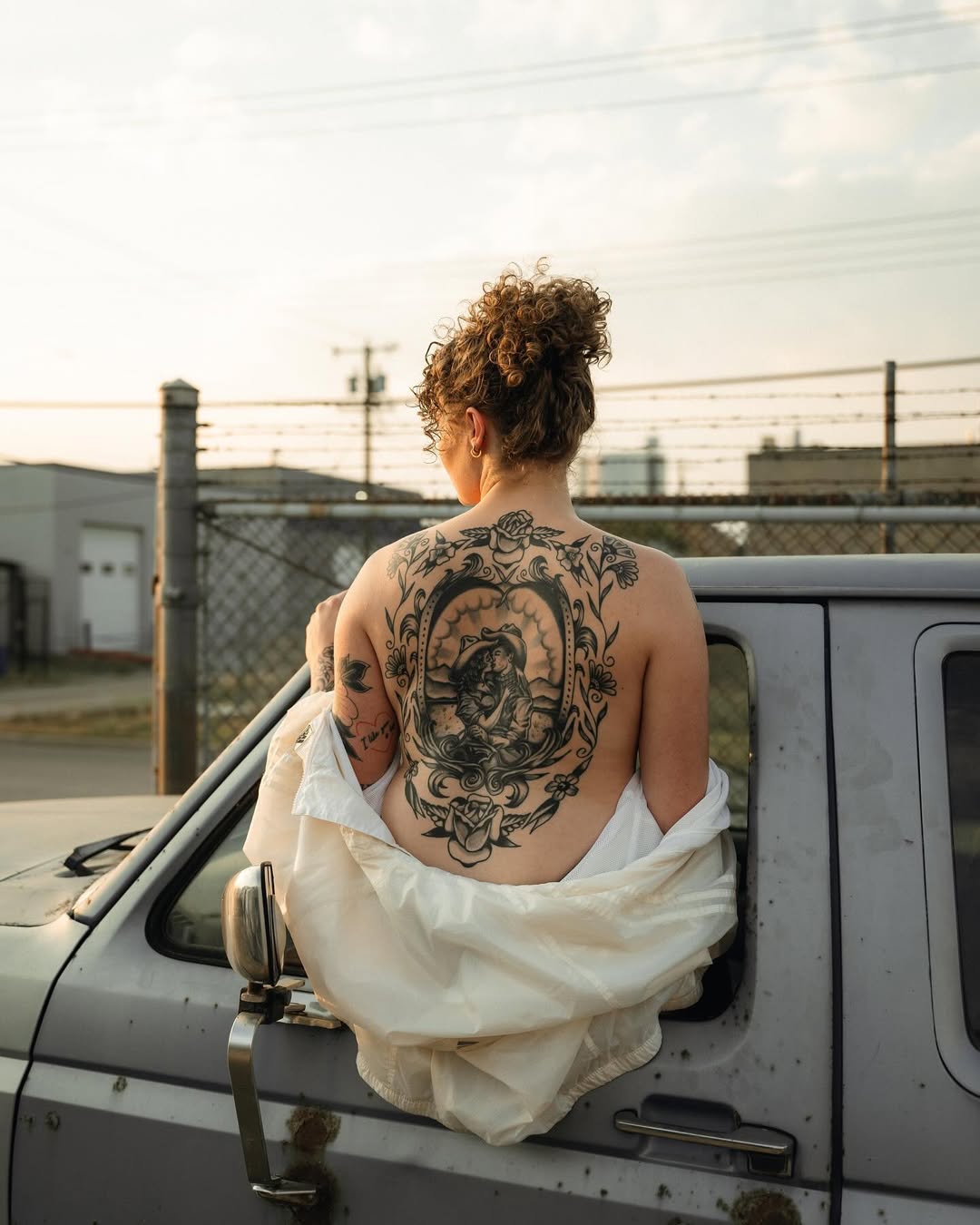 Intricate full-back ornamental blackwork with floral frame