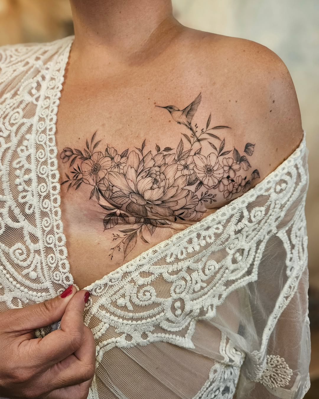 Delicate fine-line floral bouquet with a hummingbird.