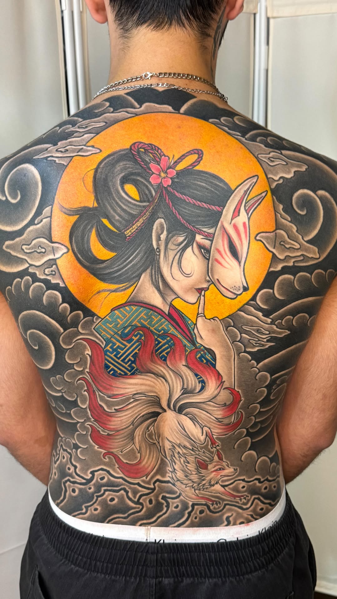 Bold Japanese back piece: geisha with fox mask