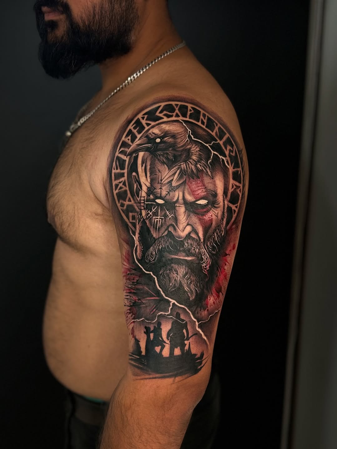Kratos-inspired black-and-gray half-sleeve with raven, storms, warriors