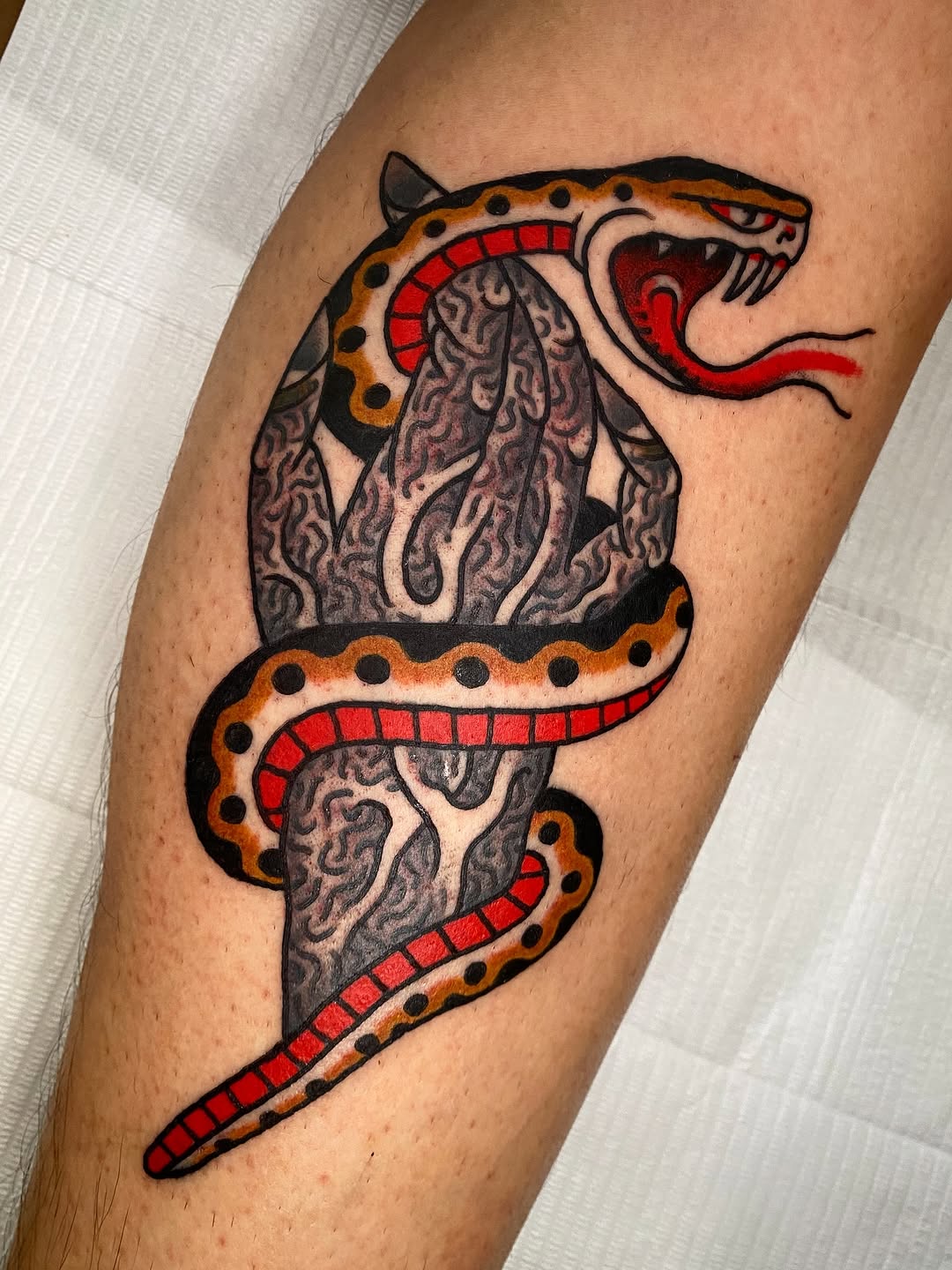 Bold neo-traditional snake with orange-gold scales and red tongue