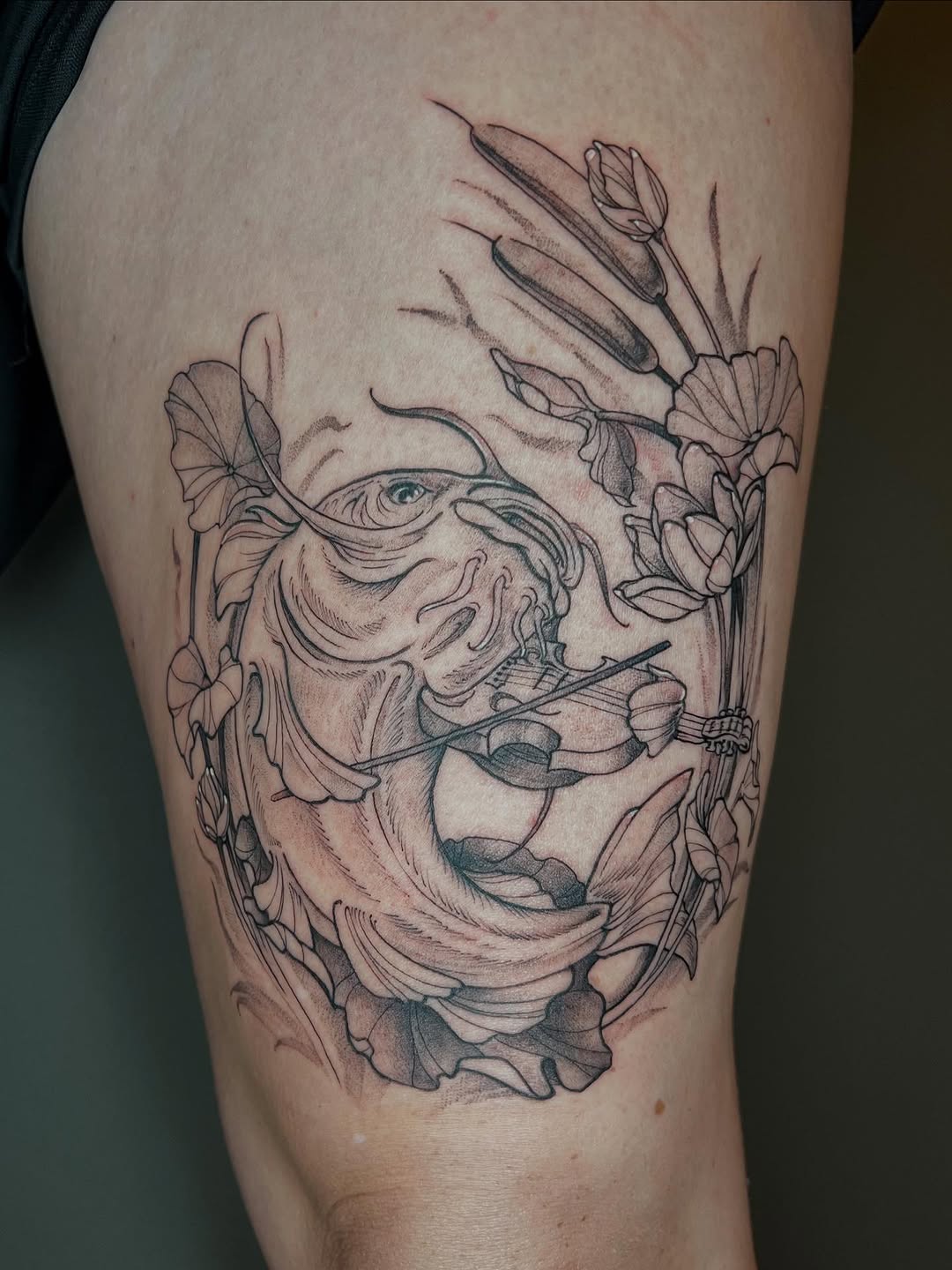 Elegant linework catfish with fiddle amid blooming vines