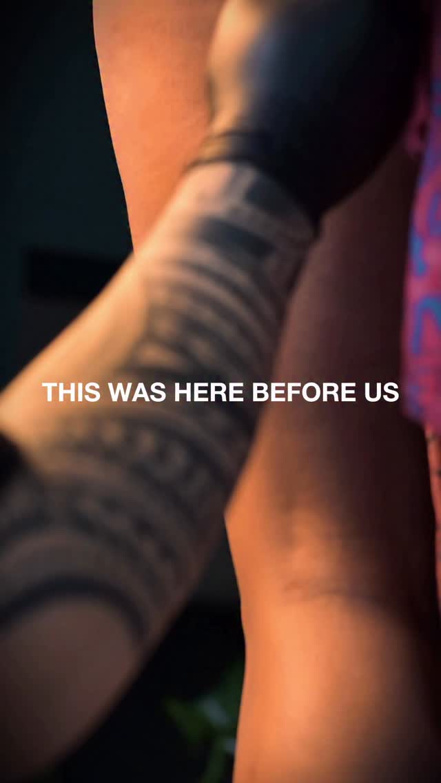 Bold black-and-gray forearm sleeve with circular banding.