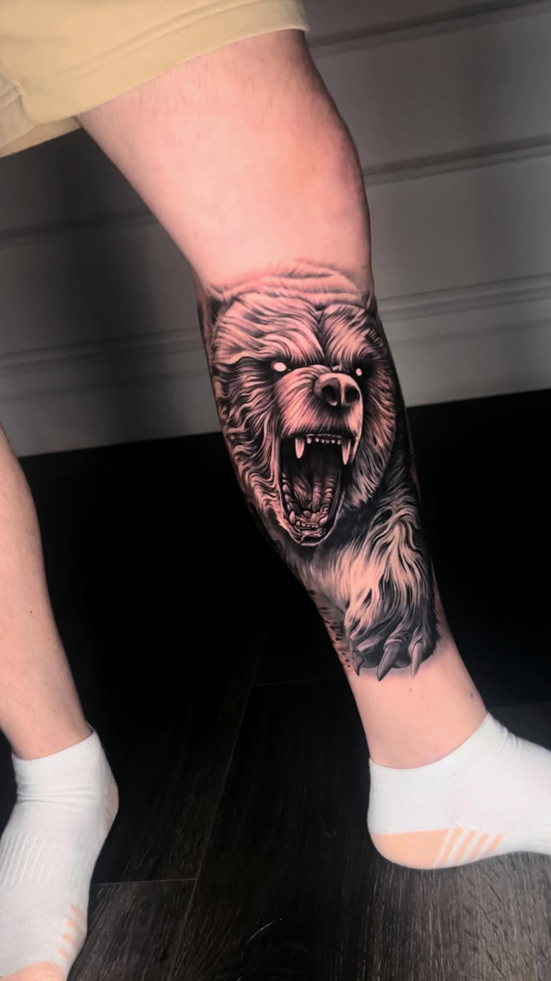 Ferocious snarling bear in bold black-and-gray shading