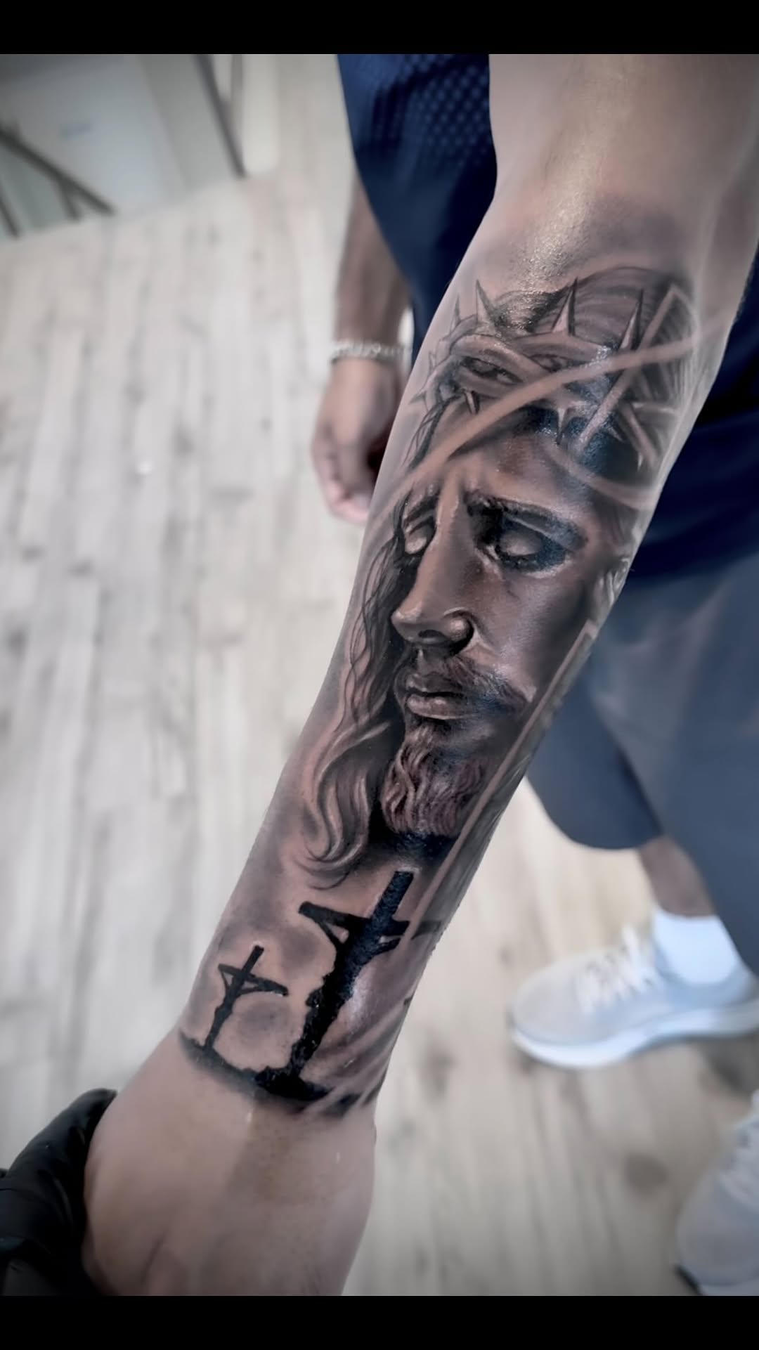 Hyper-realistic black-and-gray Jesus portrait with crown of thorns