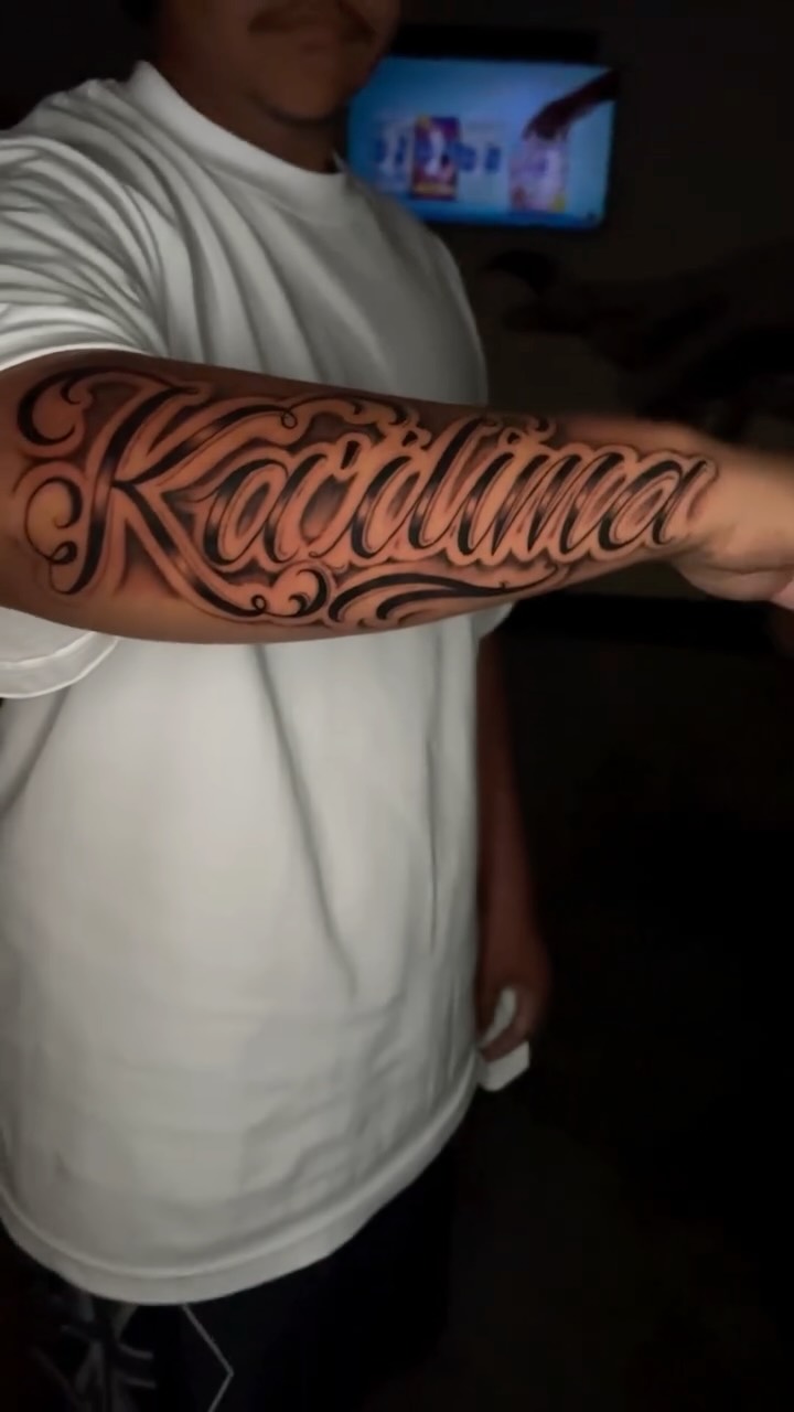 Bold black script lettering with ornamental swirls