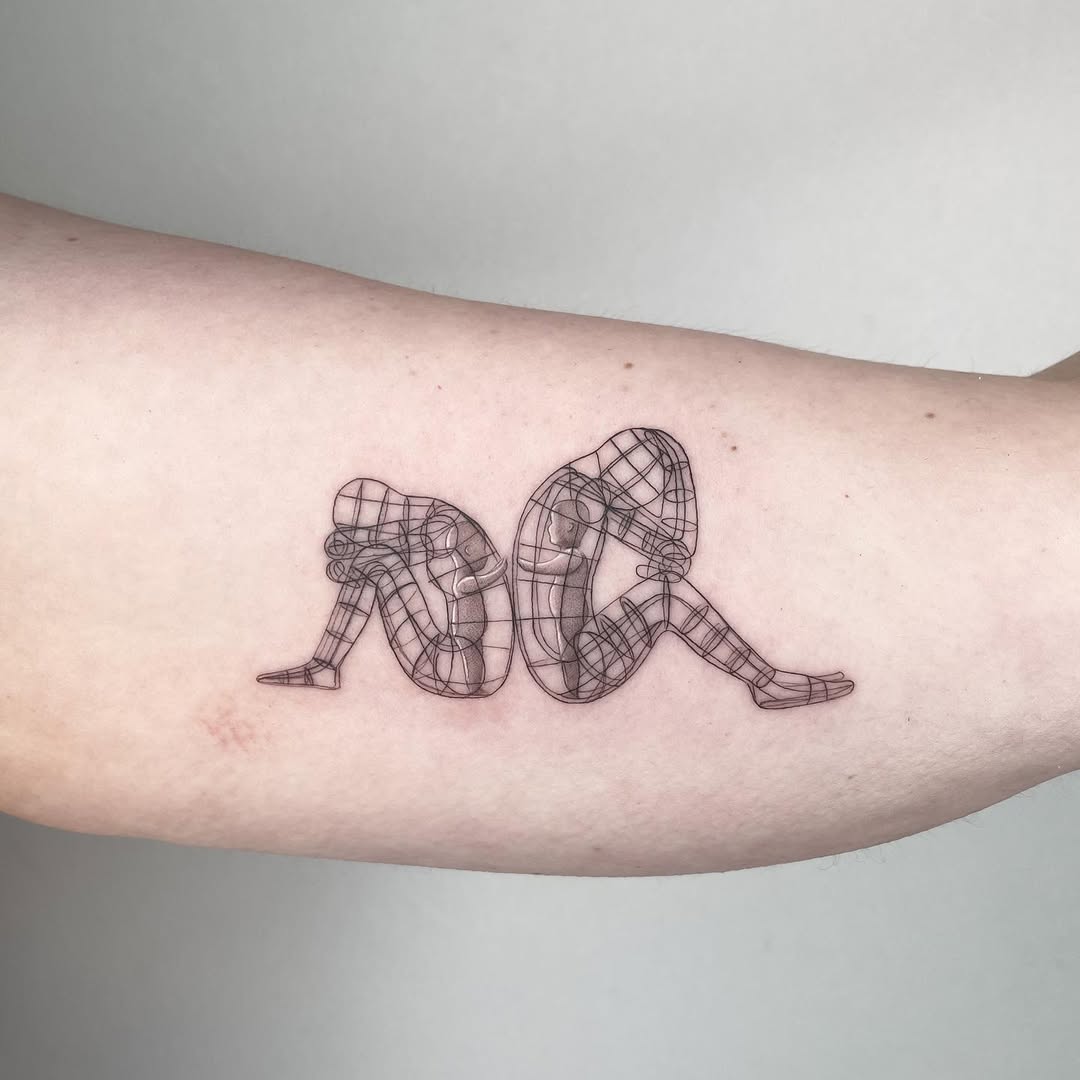 Two seated figures rendered as wireframe grid in black.