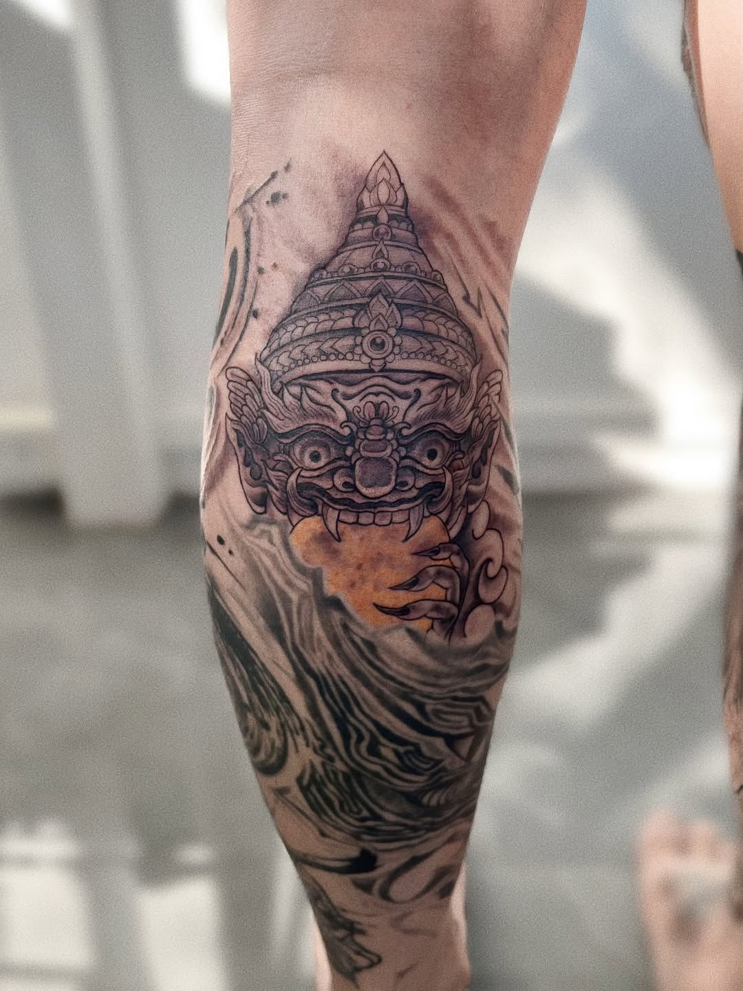 Intricate Rahu demon mask with ornate crown and waves