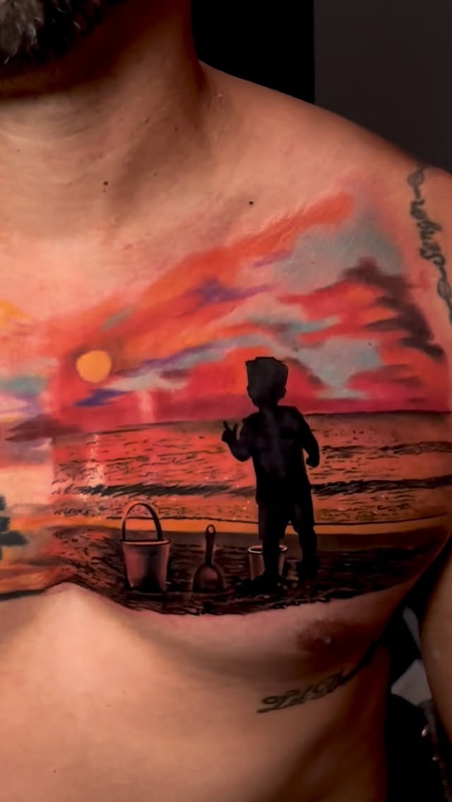 Vibrant sunset beach scene with silhouetted child