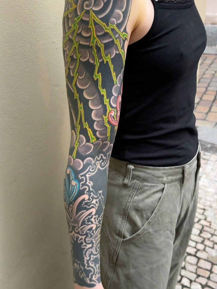 Neo-traditional Japanese sleeve with storm clouds and neon lightning