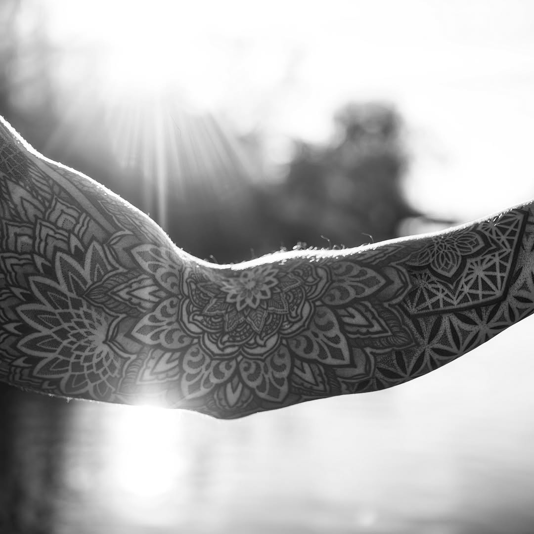 Intricate mandala-inspired geometric sleeve on forearm