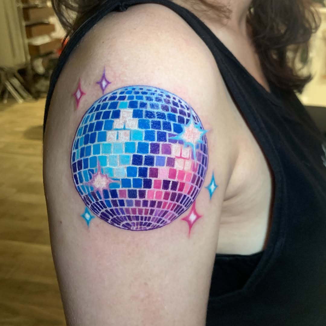 Vibrant disco ball sphere with rainbow tiles and star accents