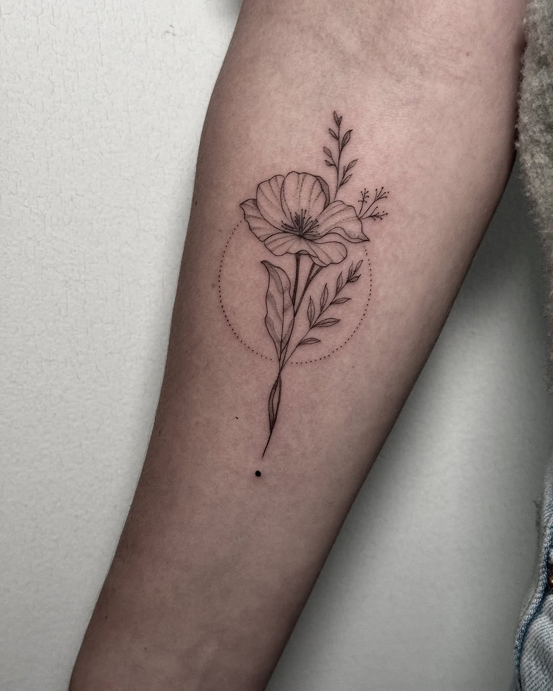 Delicate floral linework with circular dotwork halo