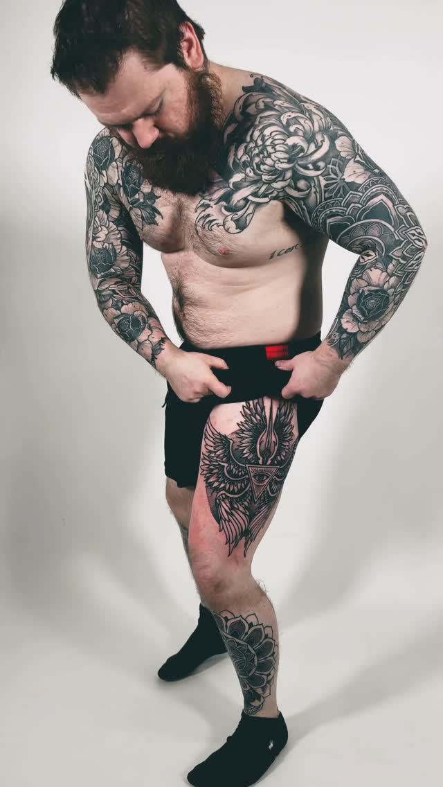 Intricate blackwork bodysuit: bold florals on arms, legpiece