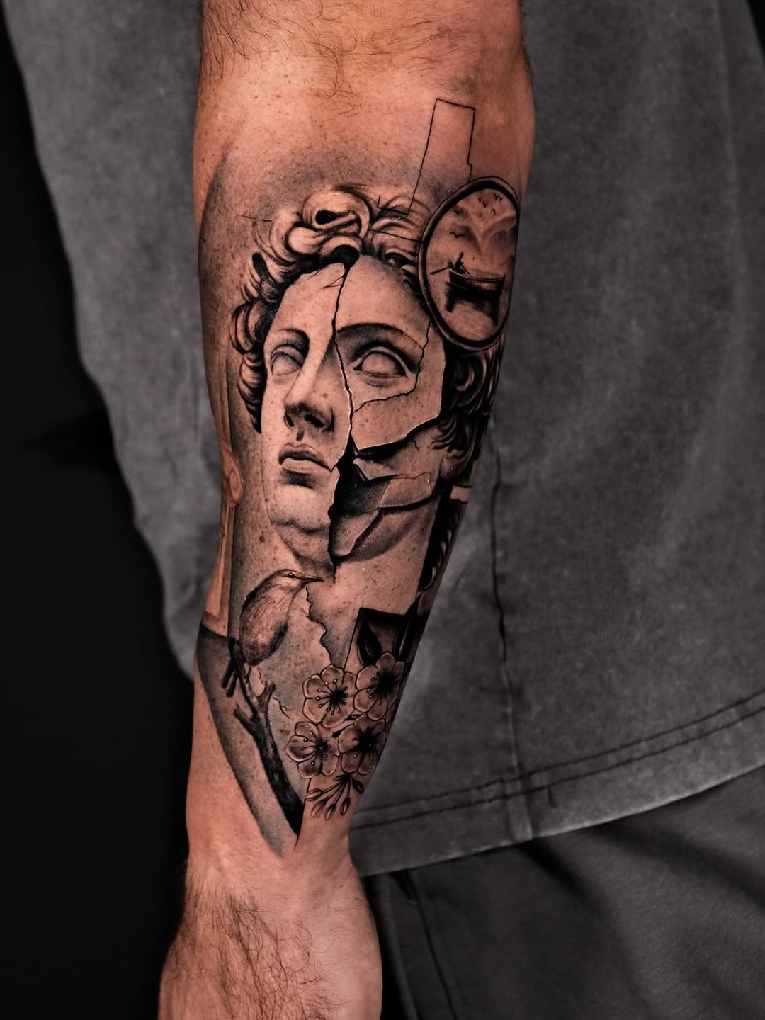 Shattered classical bust with sakura blossoms in grayscale