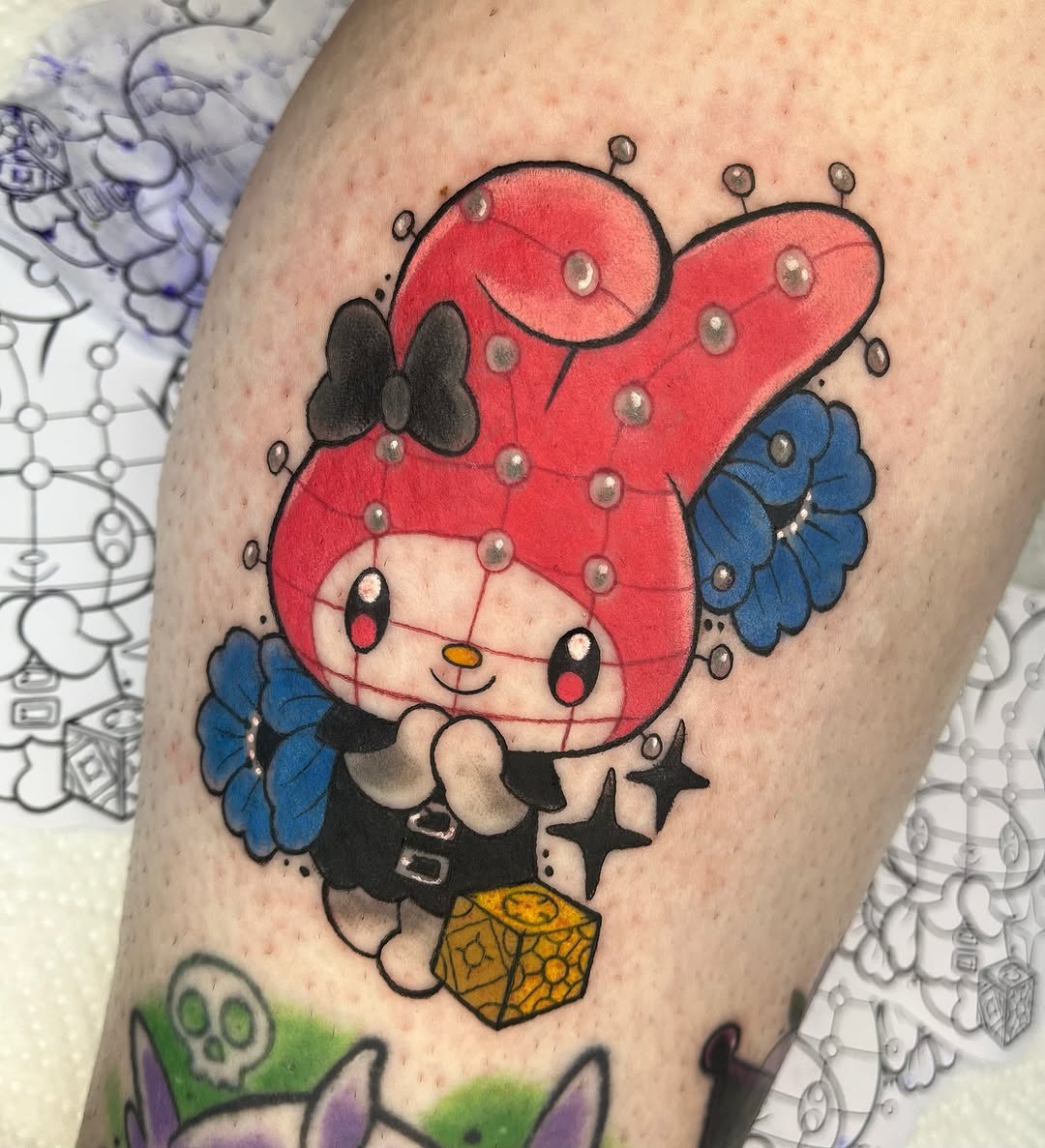 Kawaii My Melody tattoo with bold outlines and colorful accents
