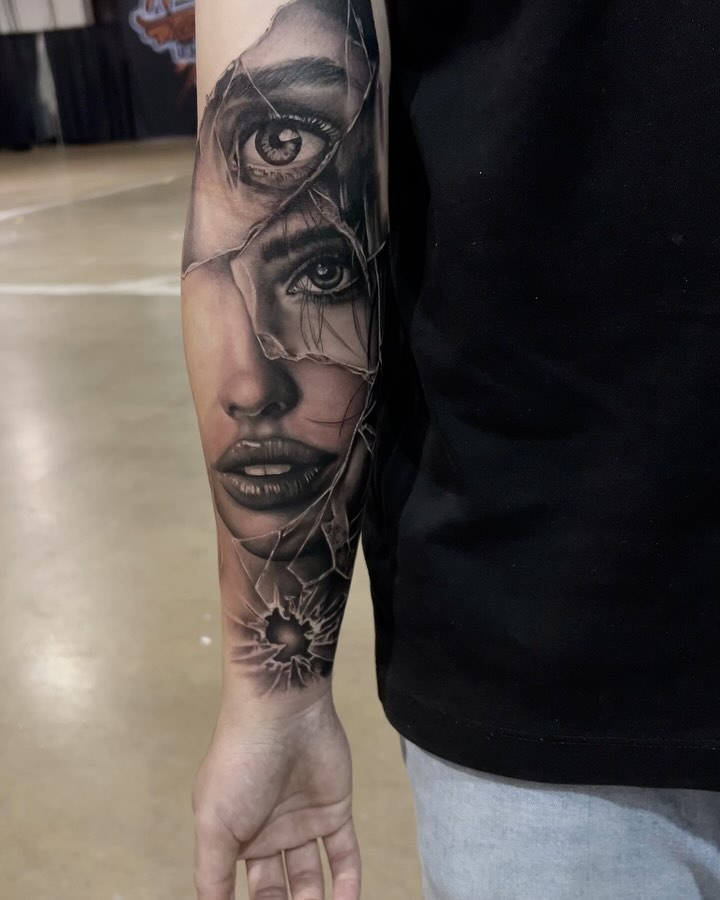 Hyper-realistic grayscale portrait of a woman's face with shattered glass