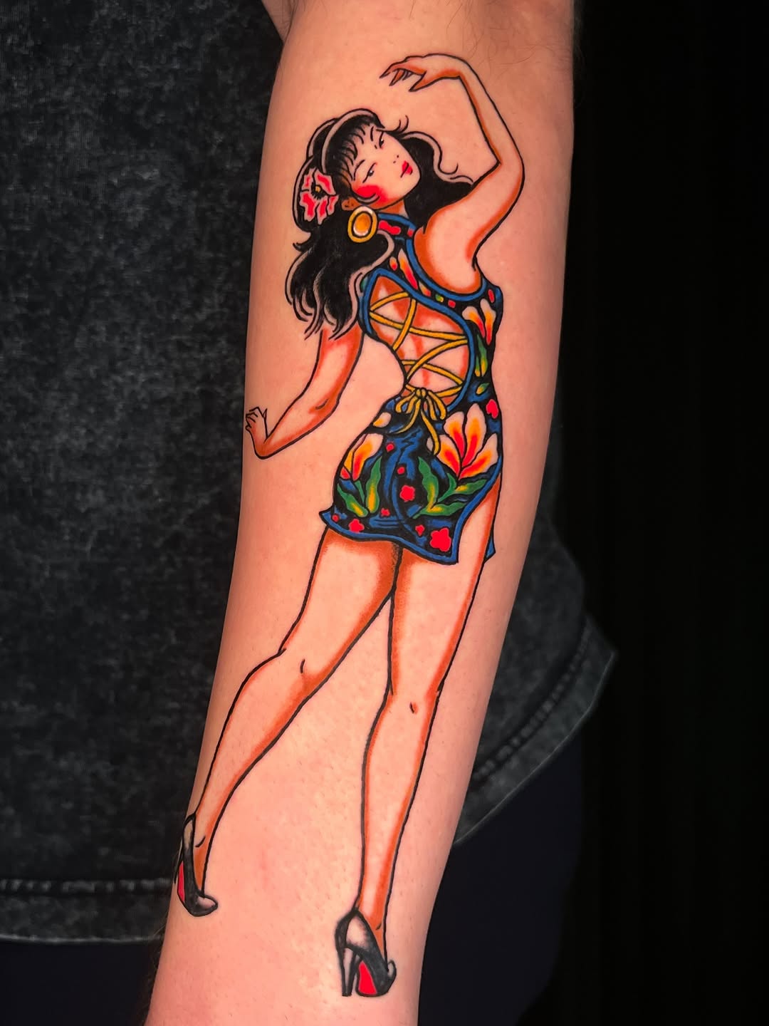 Vivid traditional pin-up girl with bold lines and florals