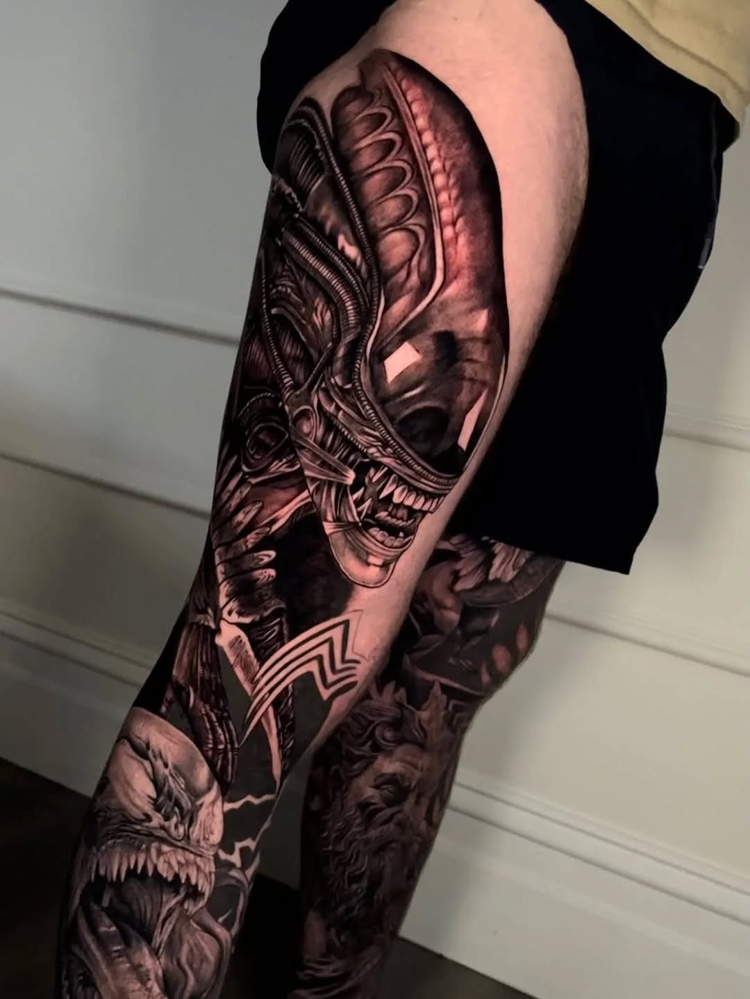 High-detail biomechanical blackwork sleeve with skull motif