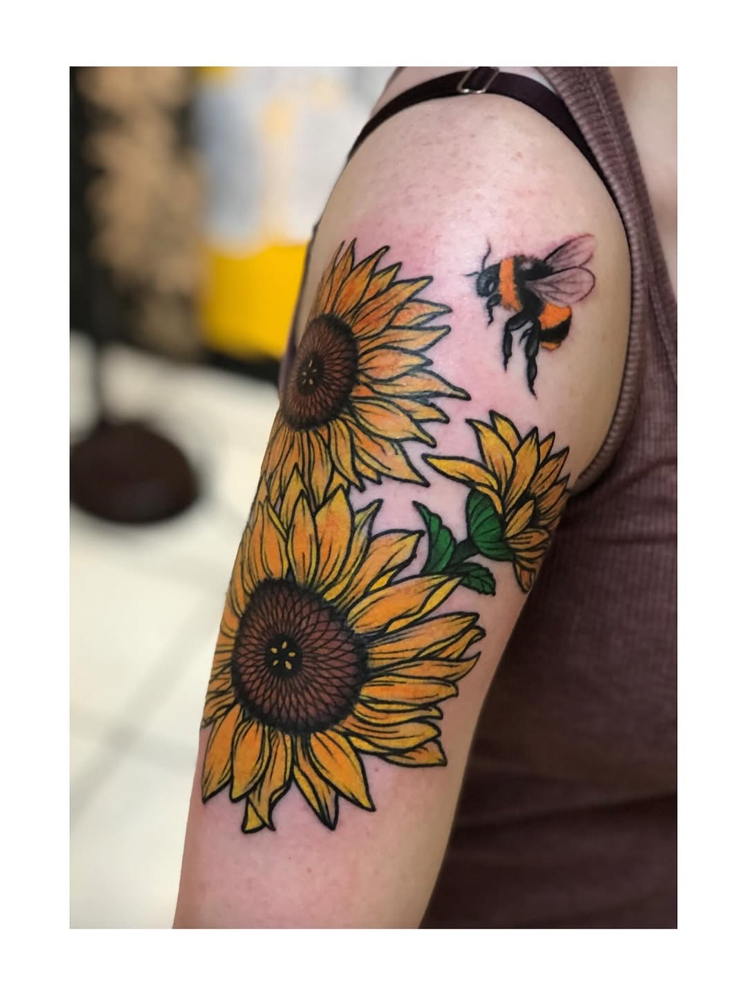 Bold sunflowers with a buzzing bee in bright color