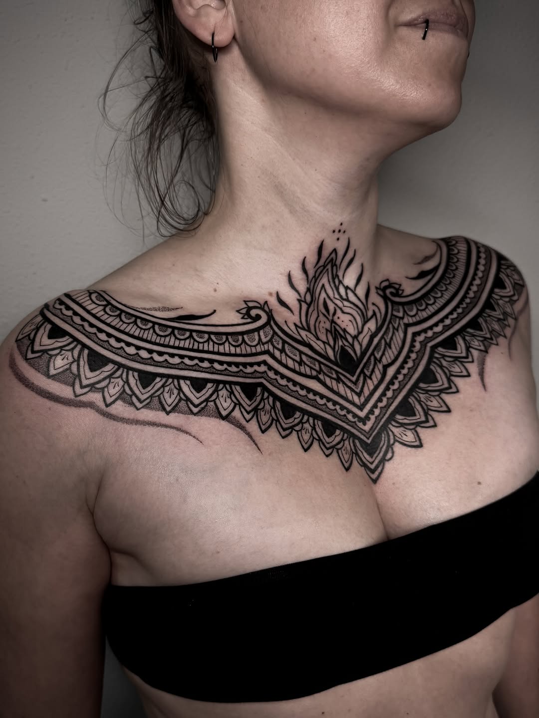 Bold blackwork ornamental neck collar with geometric details