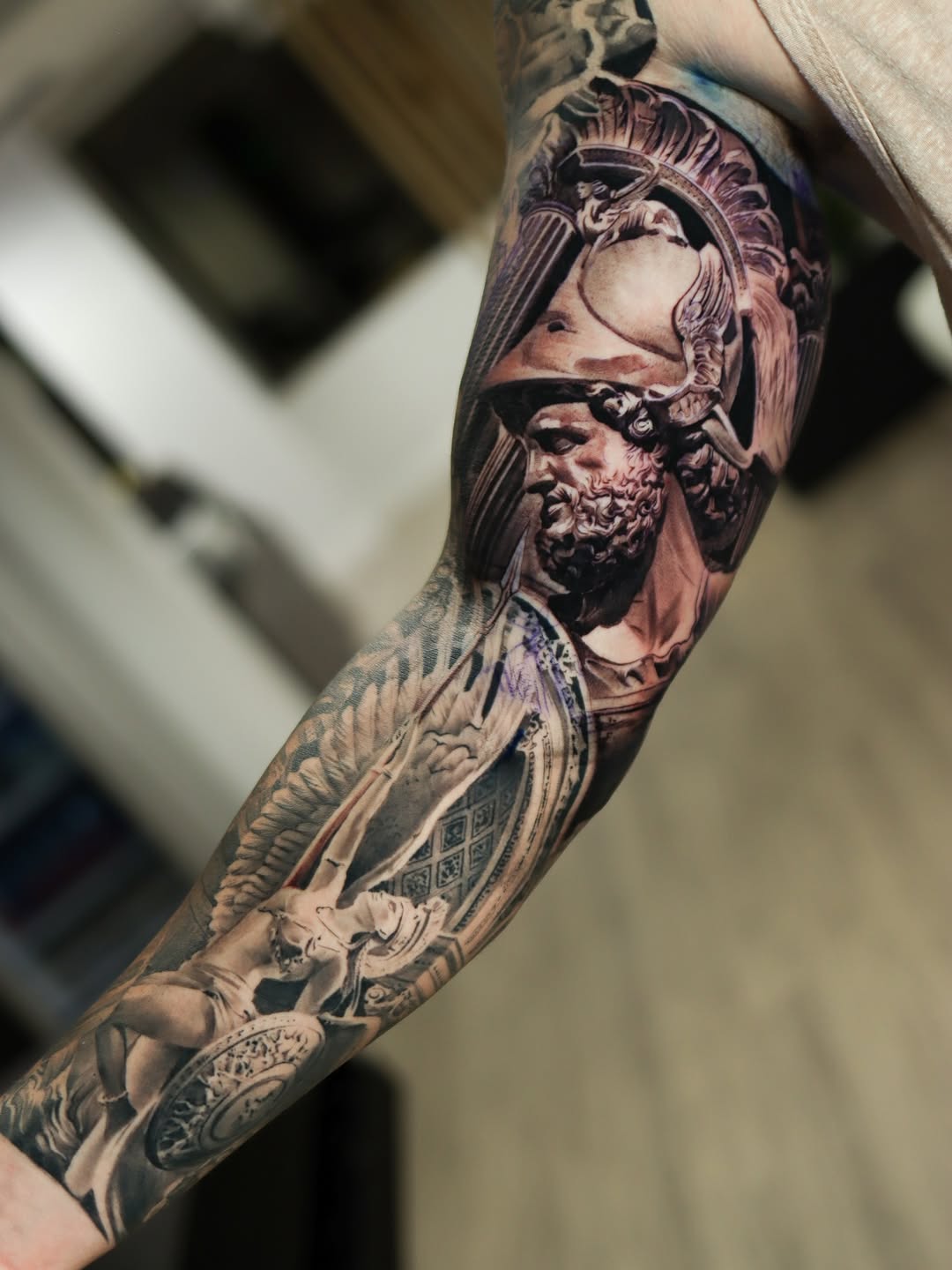 Hyper-detailed grayscale sleeve of Roman warrior and arches