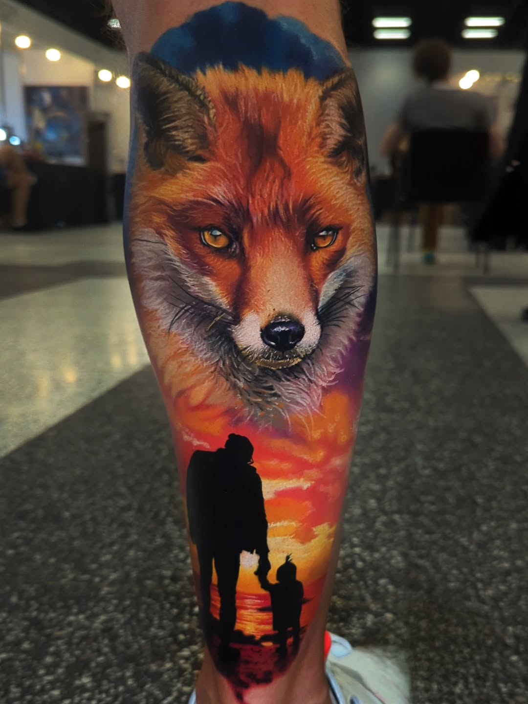 Vivid realism wolf head with sunset-family silhouettes.