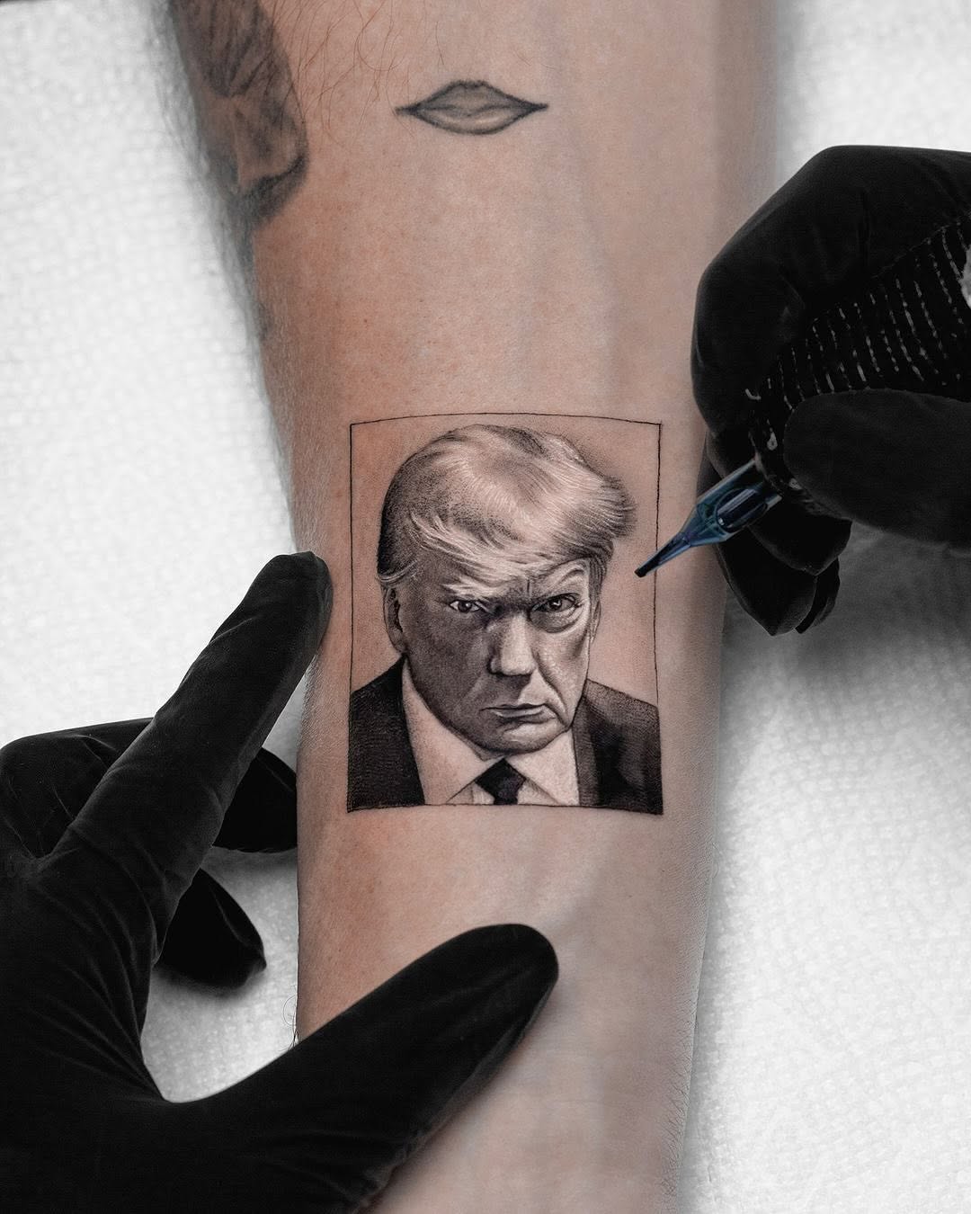 Hyper-detailed black-and-gray realism portrait framed in square.