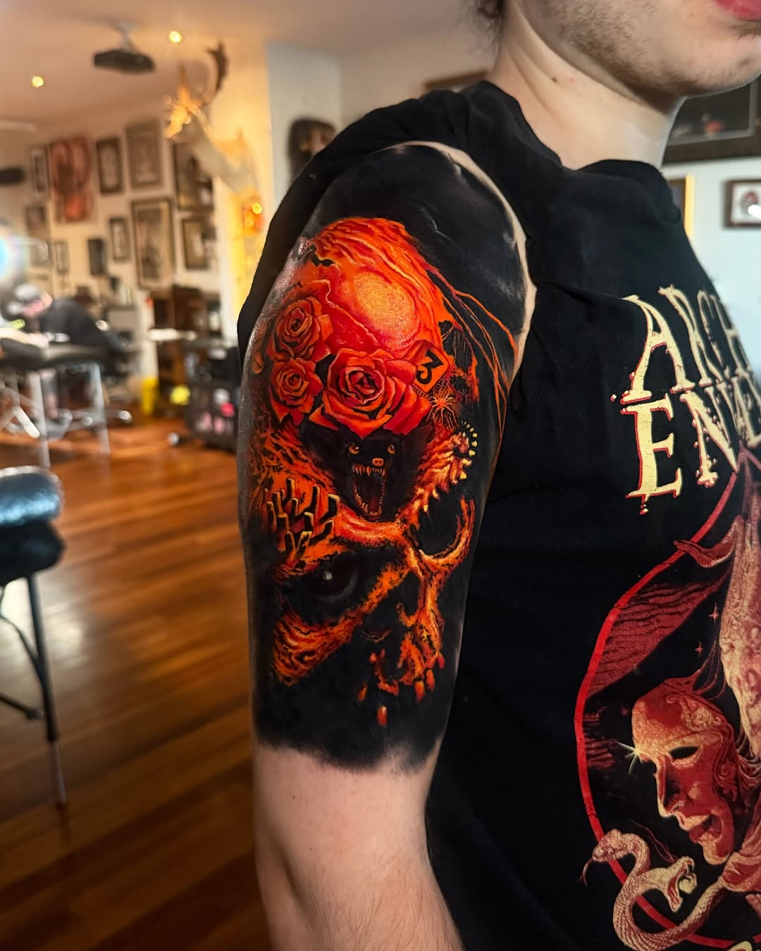 Fiery neo-traditional sleeve with roses and snarling demon