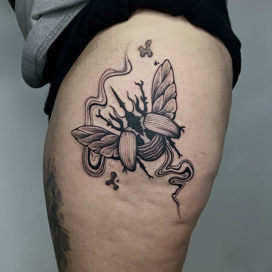 Surreal blackwork beetle with winged, ribbon-like extensions