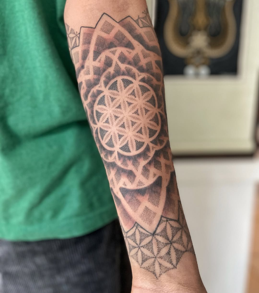 Intricate geometric mandala sleeve with dotwork shading
