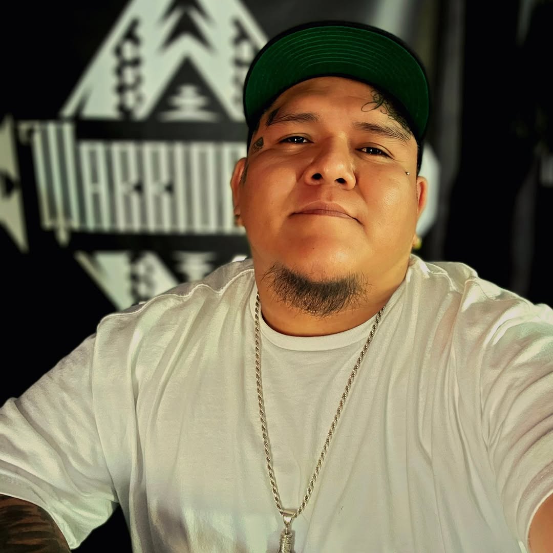 Close-up of bold facial teardrop tattoo