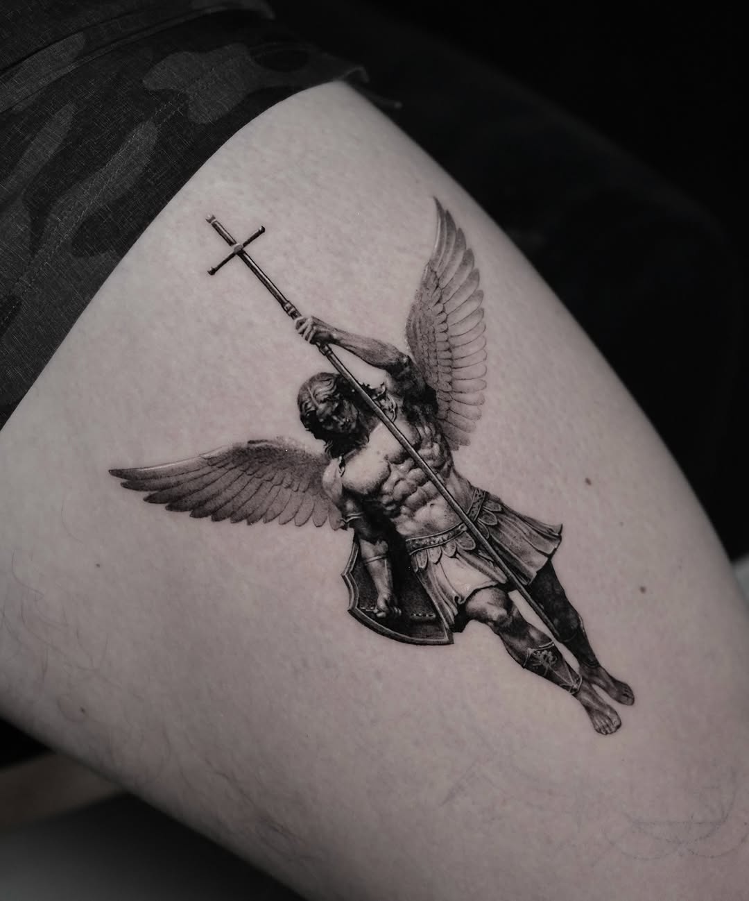 Dynamic archangel with broad wings, spear, shield