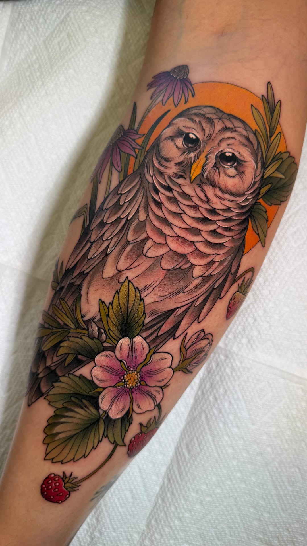 Barred owl centerpiece with vibrant botanical accents.