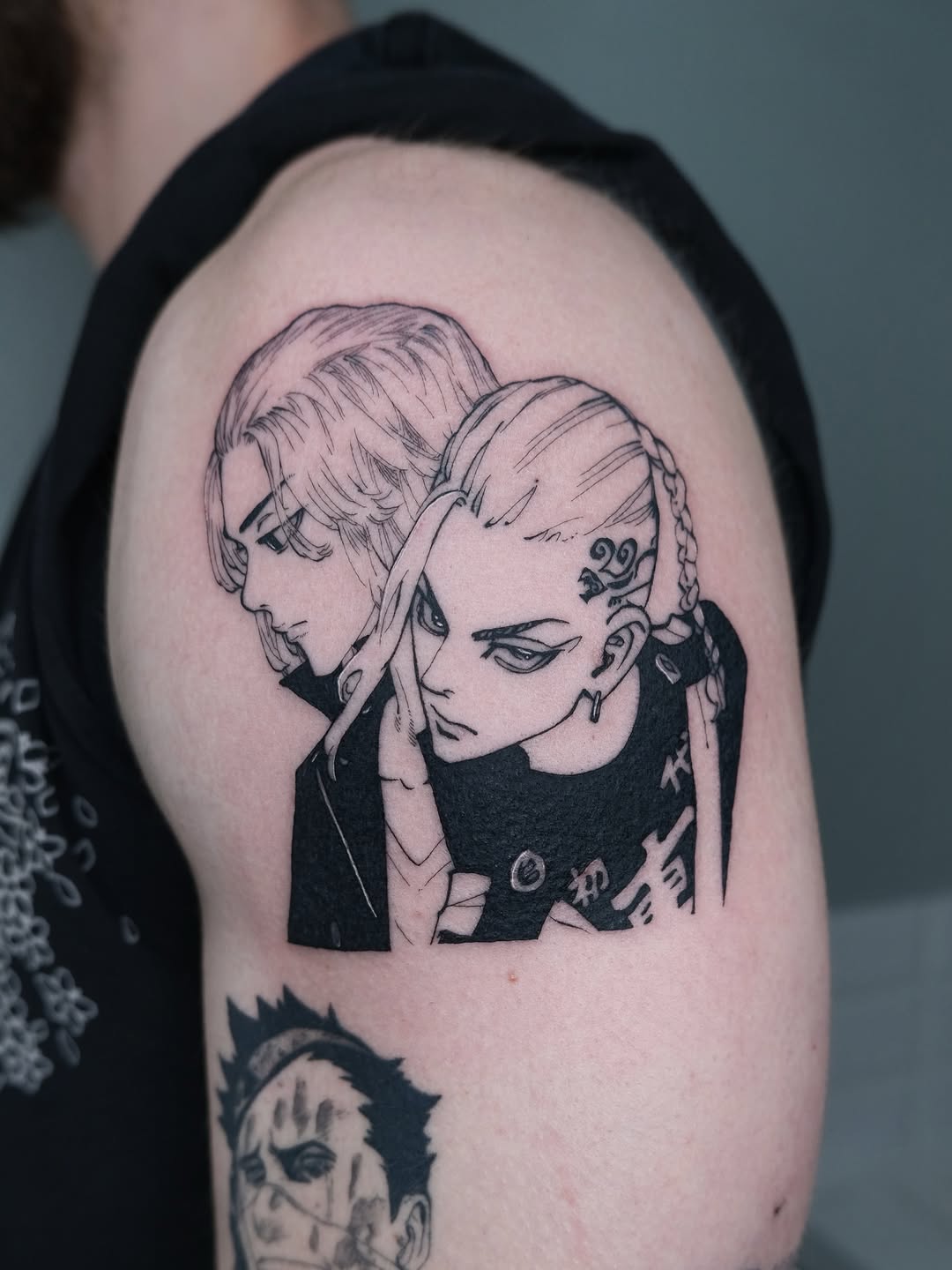 Two anime-inspired characters in bold linework, intense expressions