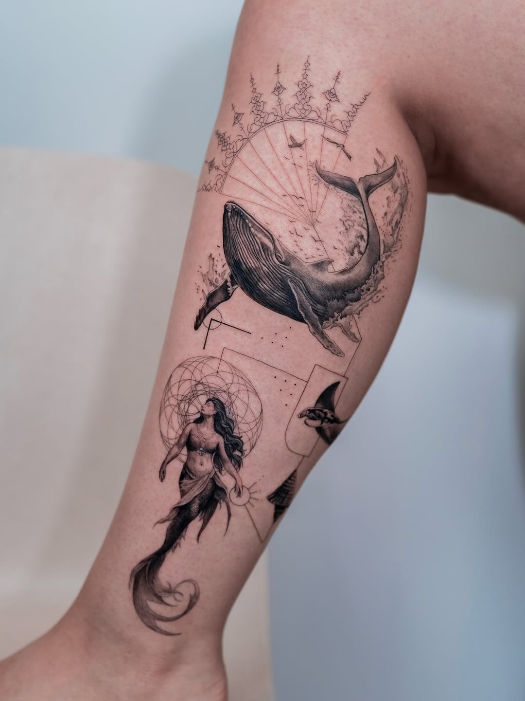 Delicate blackwork nautical piece with mermaid and whale