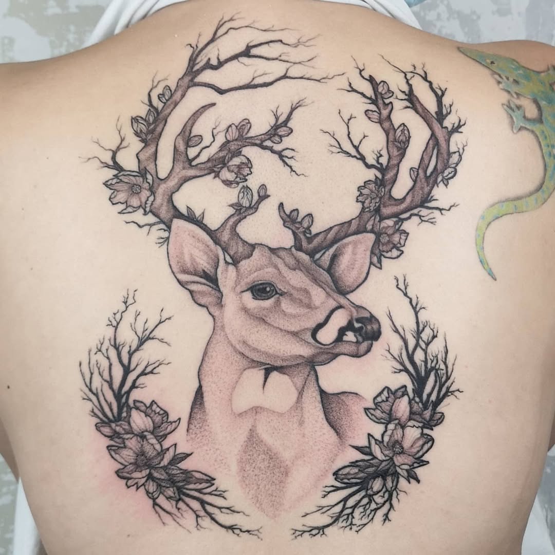 Stag head with branch-like antlers and blossoms