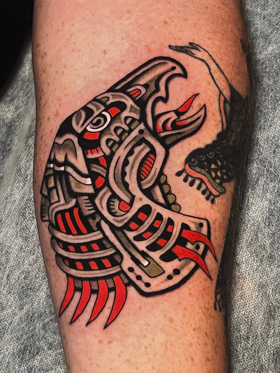 Bold robotic bird with red-black mechanical detailing