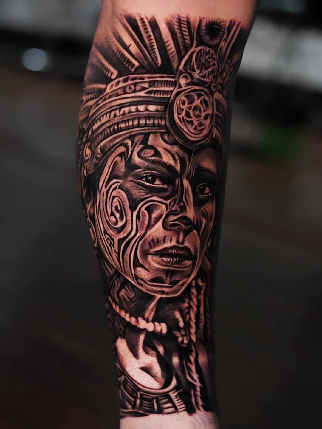 Intricate Aztec warrior mask in bold blackwork
