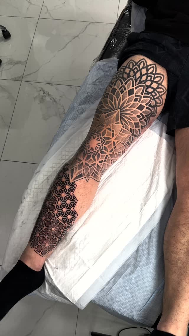 Intricate geometric leg sleeve with tessellated mandalas