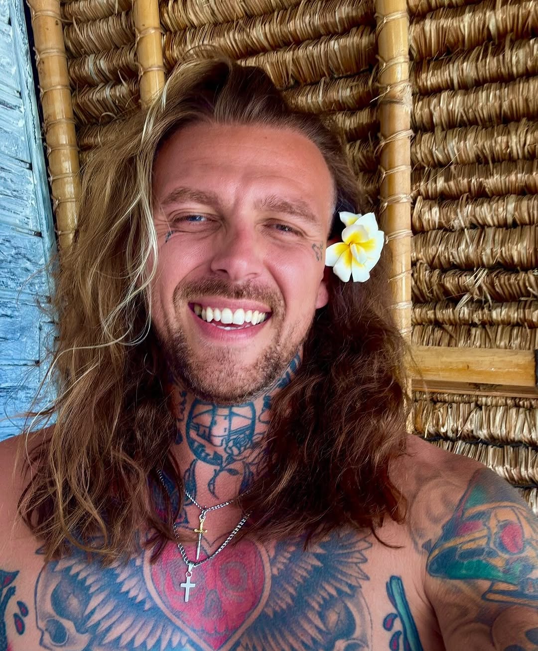 Vibrant chest piece with winged heart, bold neck art