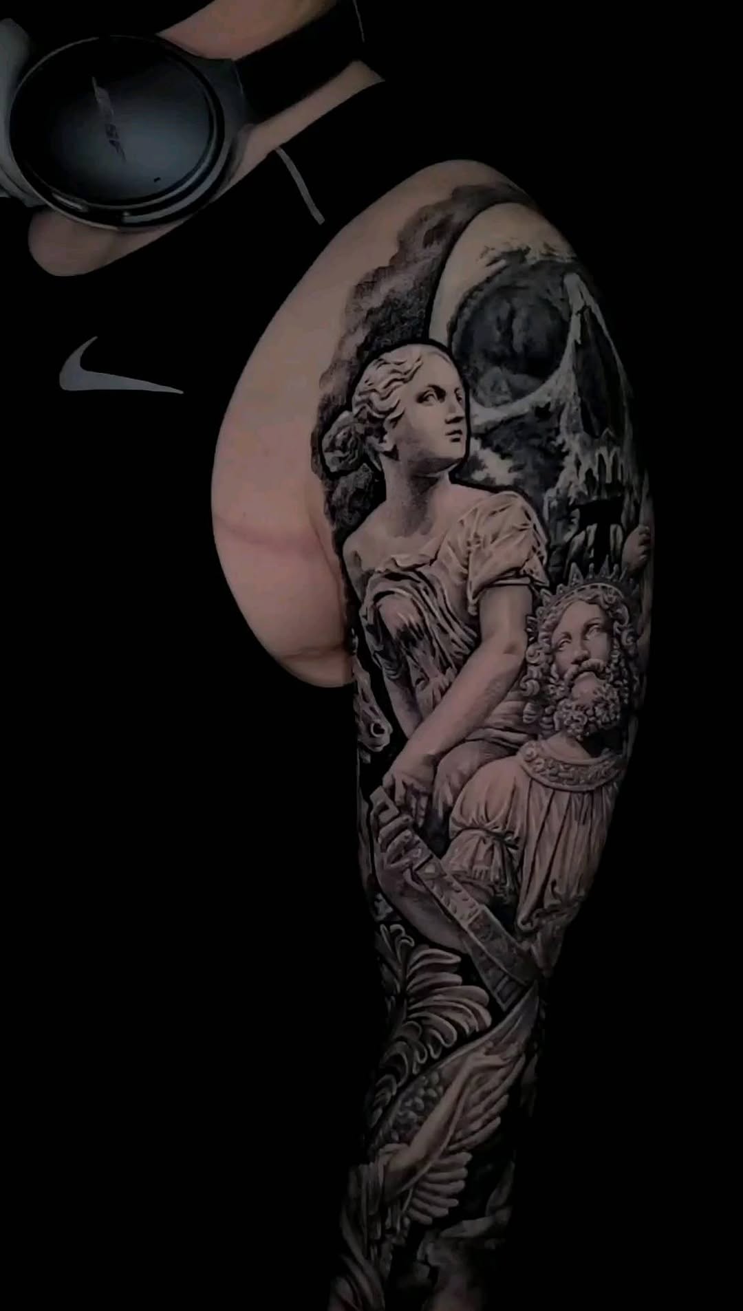 Elaborate black-and-grey mythic sleeve with classical figures